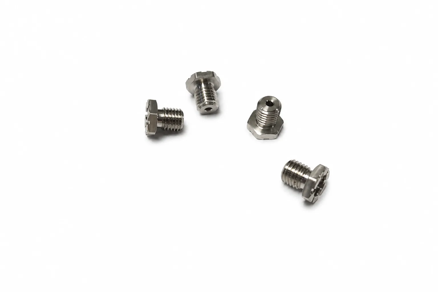 Precision-machined miniature screws with hexagonal heads